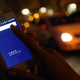 In this photo illustration, a woman uses the Uber app on a smartphone Sept. 2, 2014, in Berlin.
Adam Berry/Getty Images